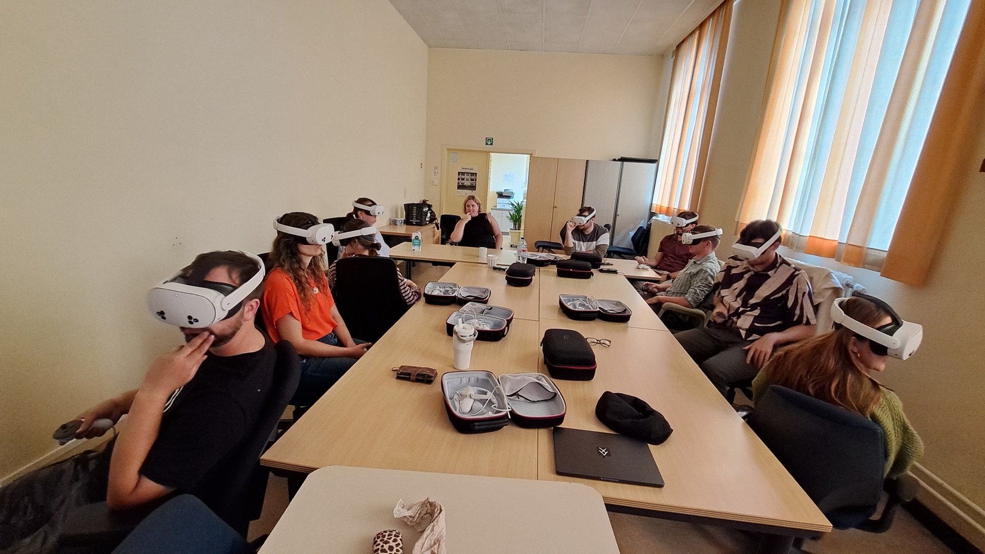 A group of professionals wearing VR headsets during a test session
